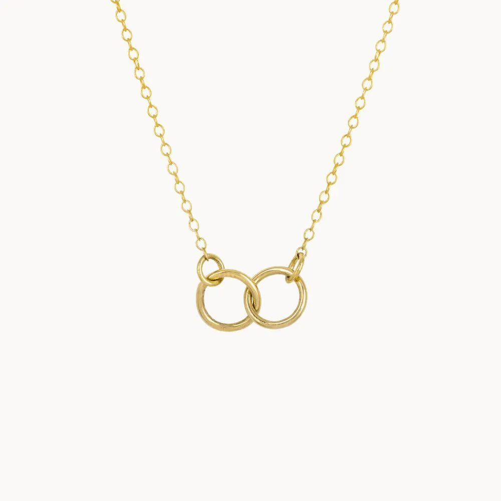 necklace on white background, connected by two gold hoopes