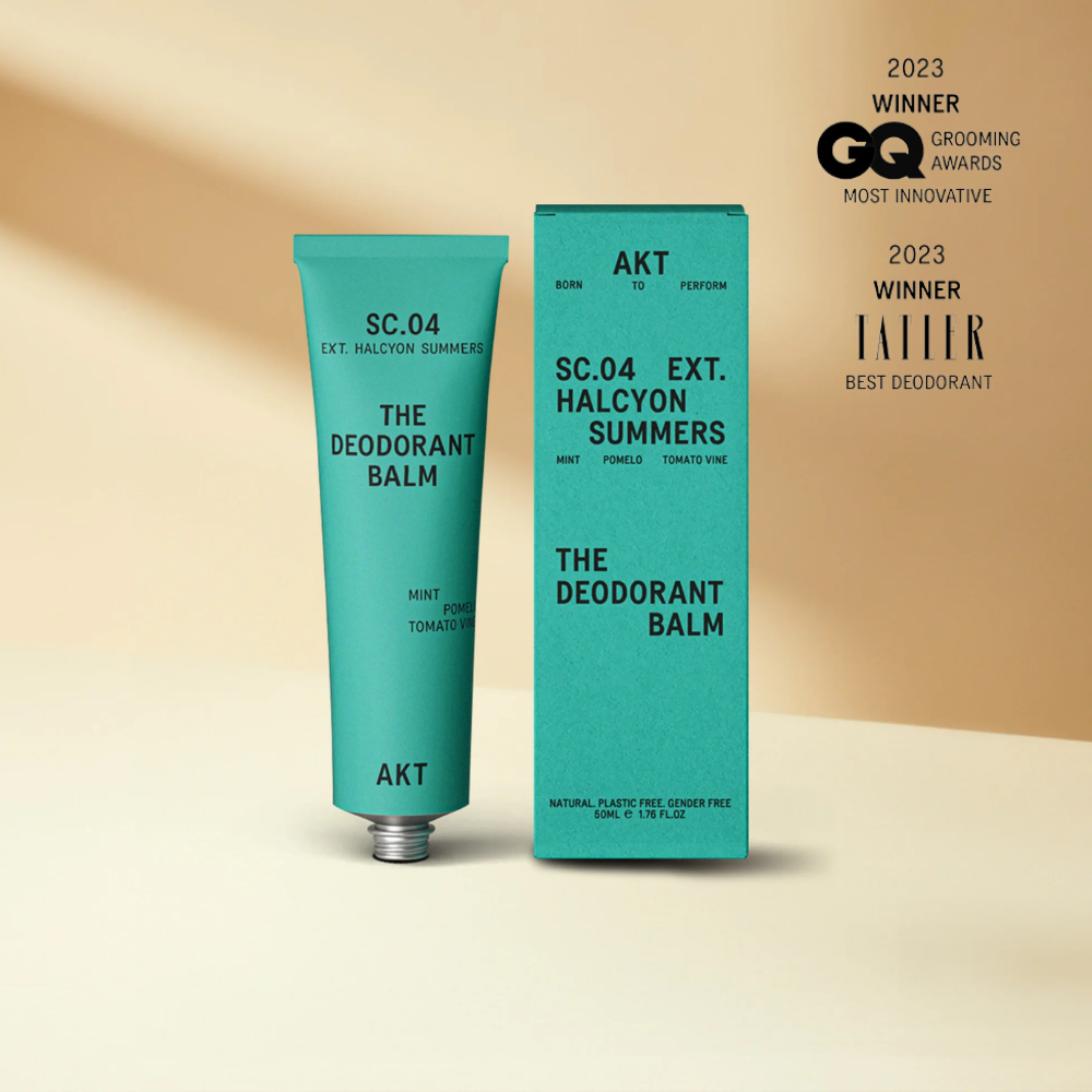 Deodorant balm with packaging on a beige background, featuring awards on the right.