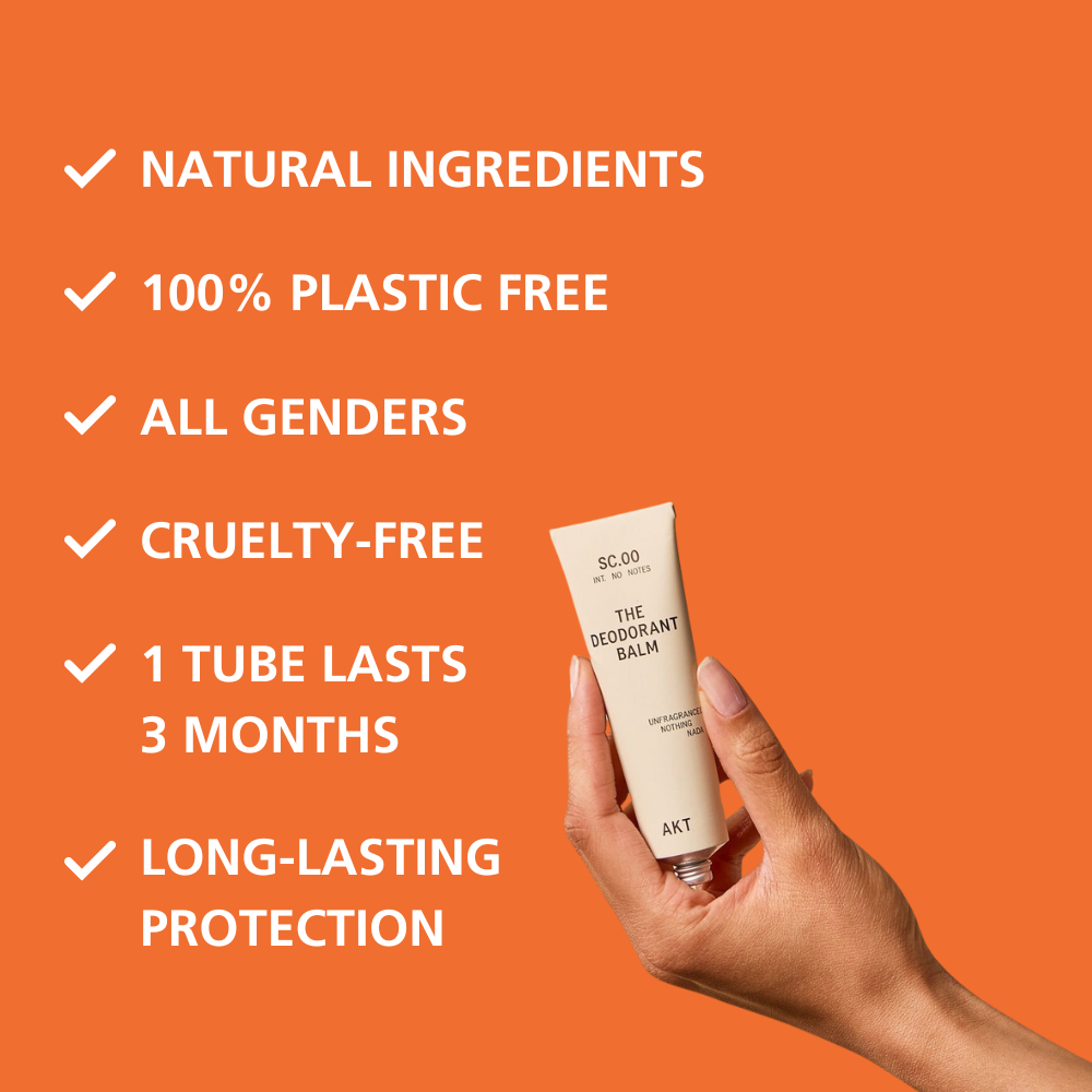 Hand holding a deodorant balm with product features listed on an orange background