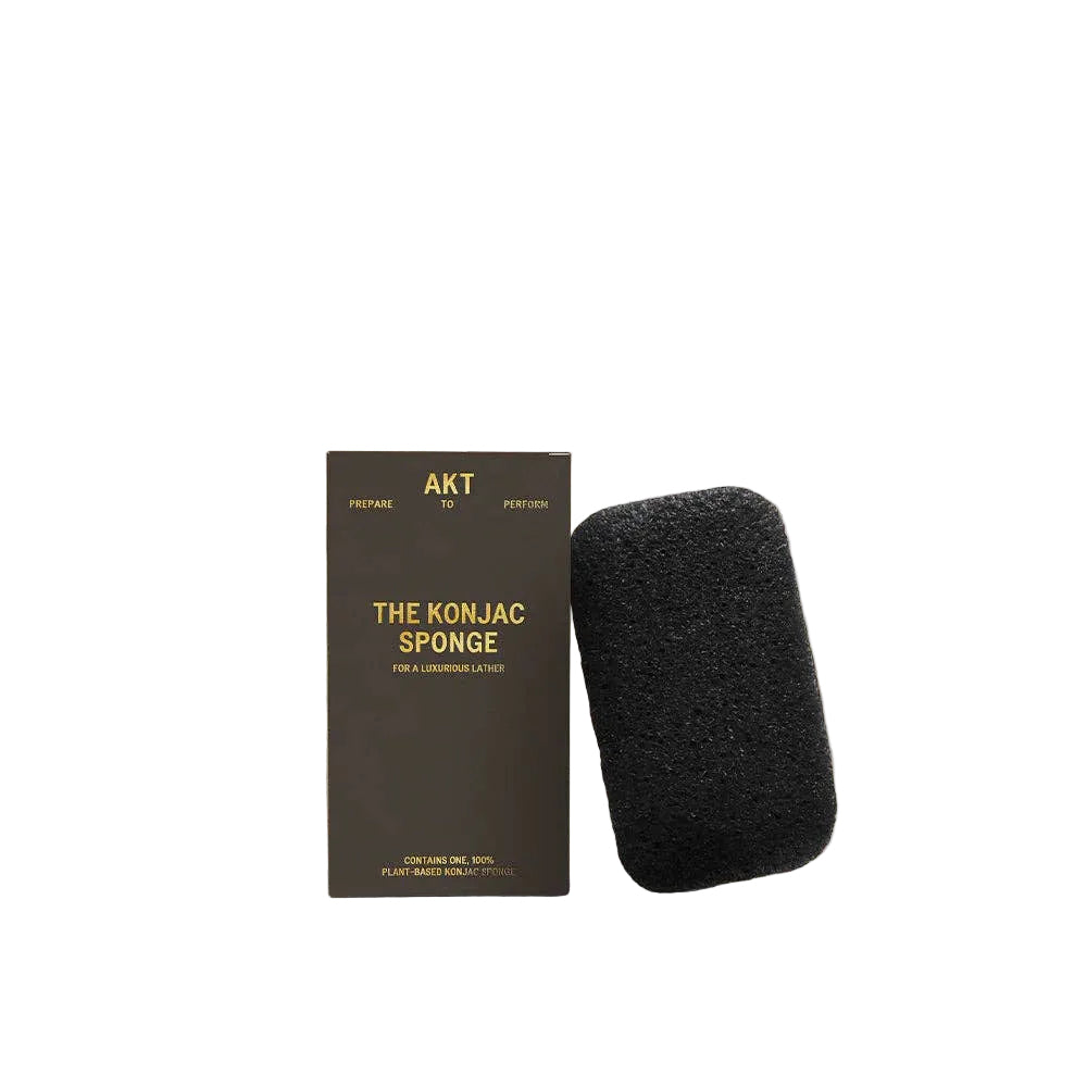 Black Konjac sponge with packaging on a white background 