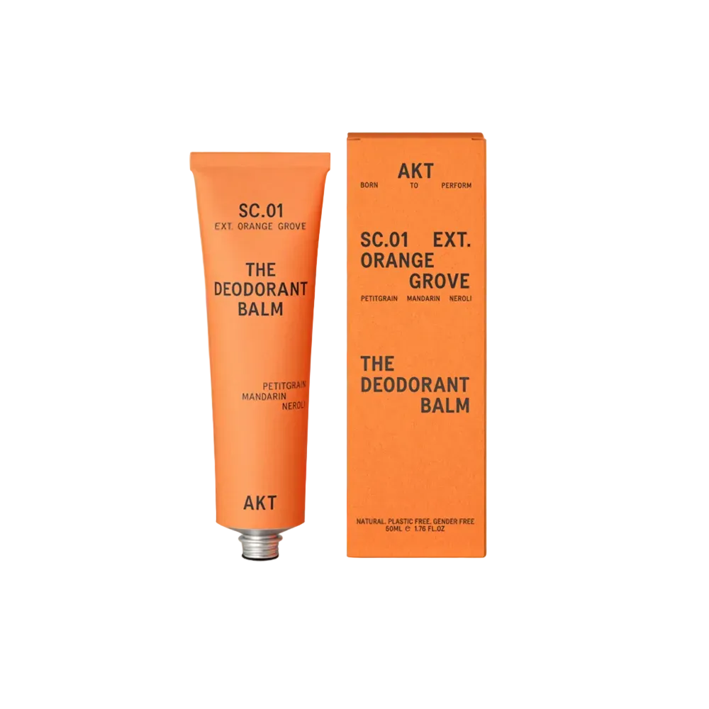 Orange Grove deodorant balm tube and packaging on a beige background