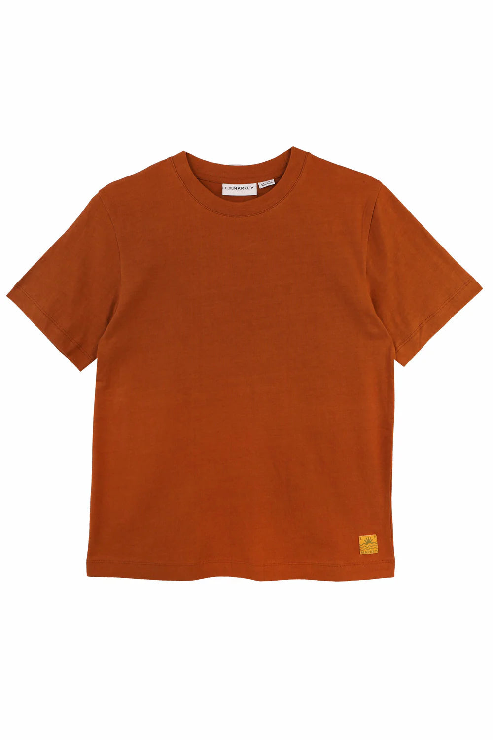 Brown t-shirt with a small label on a white background