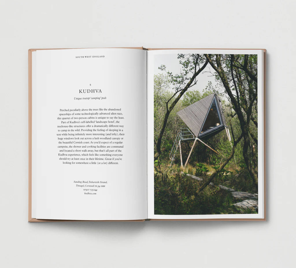 Open book with a photograph of a treehouse in a forest on the right page.