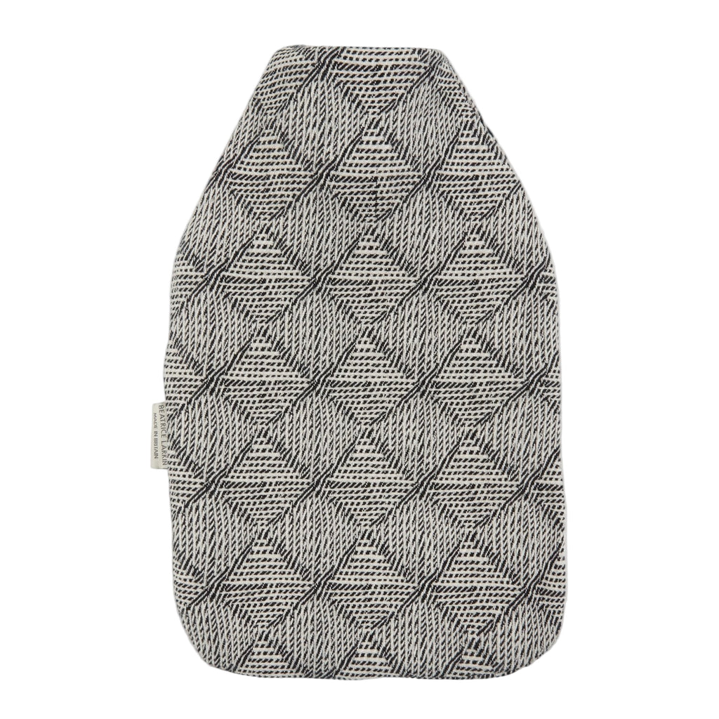 Textured gray and black patterned dog coat on a light gray background