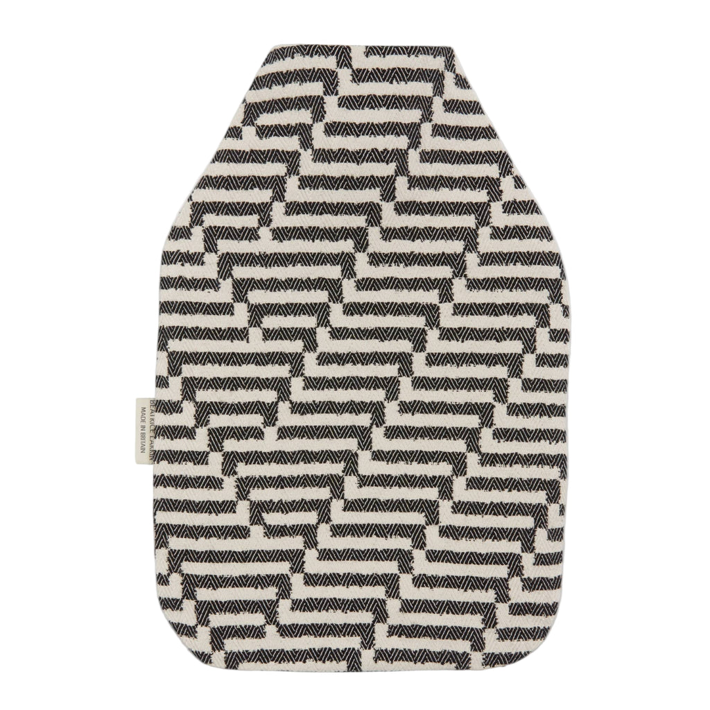 Beatrice Larkin Black and white patterned hot water bottle cover on a light gray background