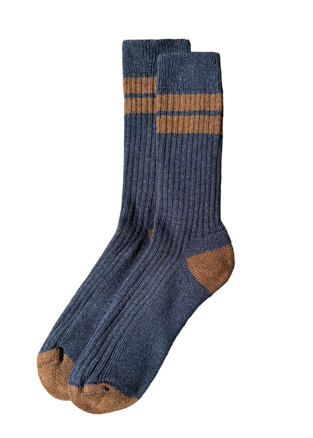 Pair of blue socks with brown accents on a light gray surface
