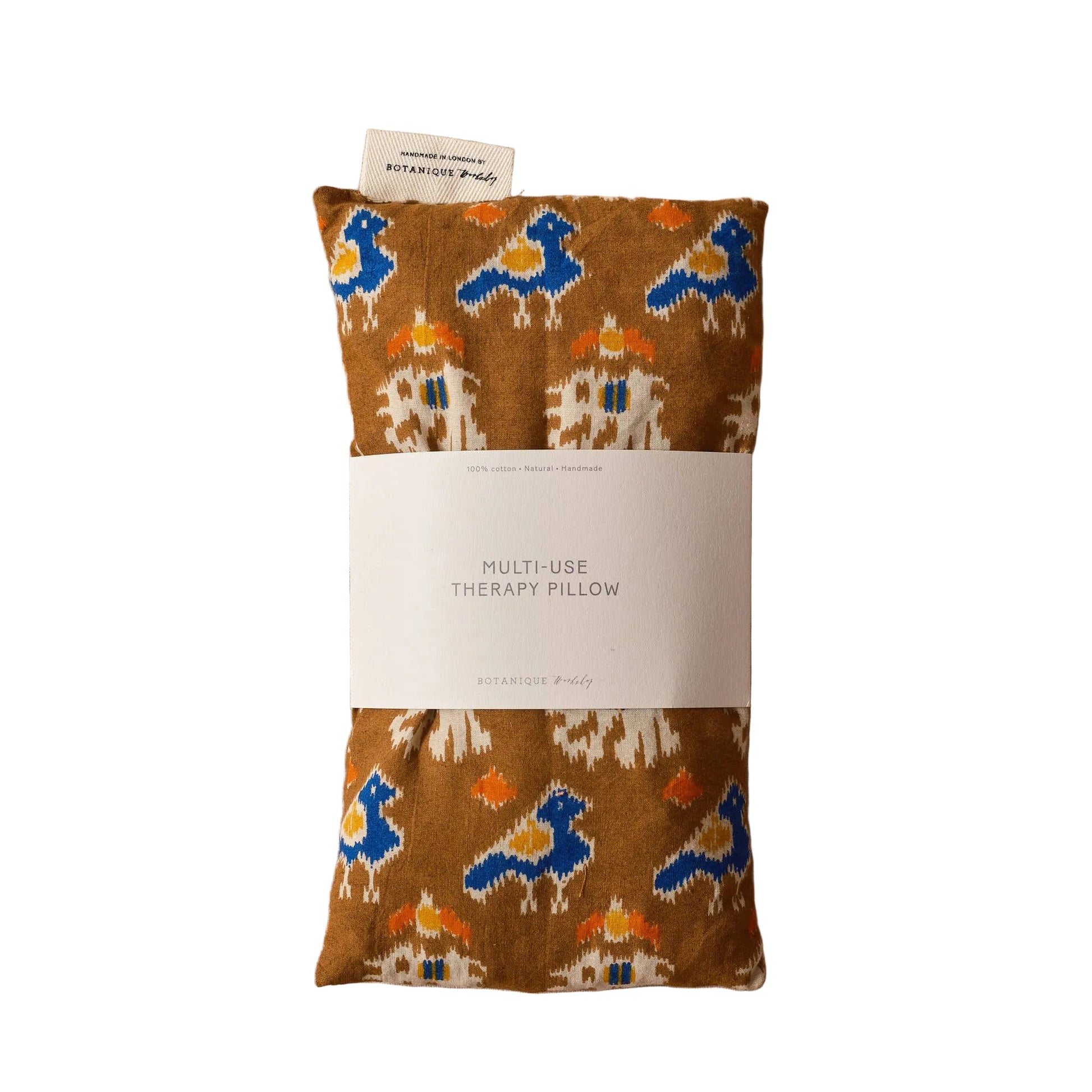 Botanique Workshop multicolored pillow with a label on a white background