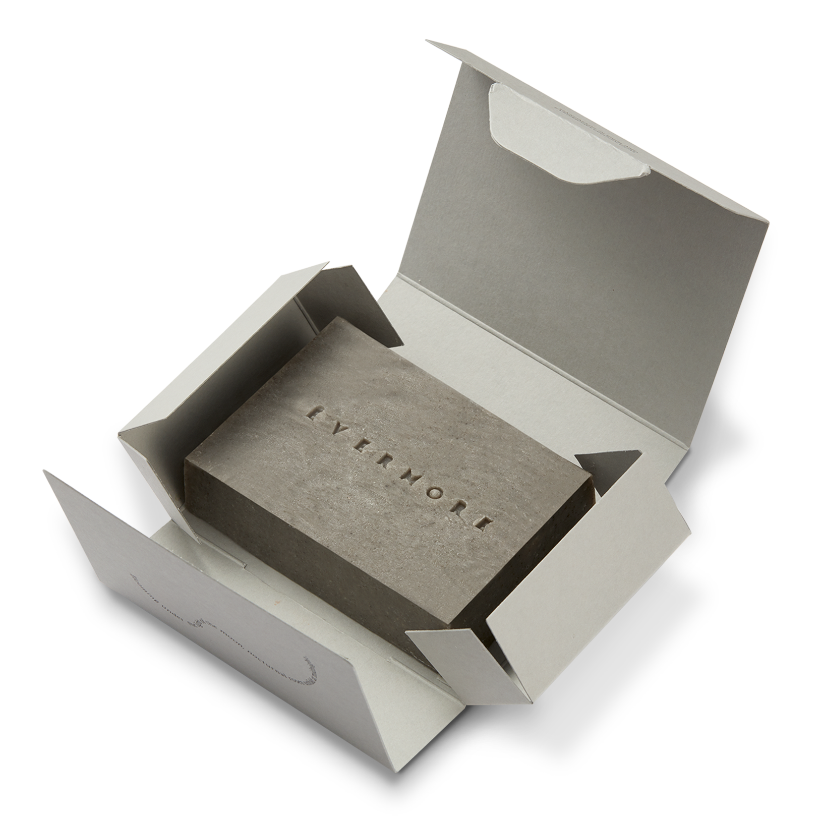 Open box with a grey soap bar inside, branded 'Evermore', on a white background