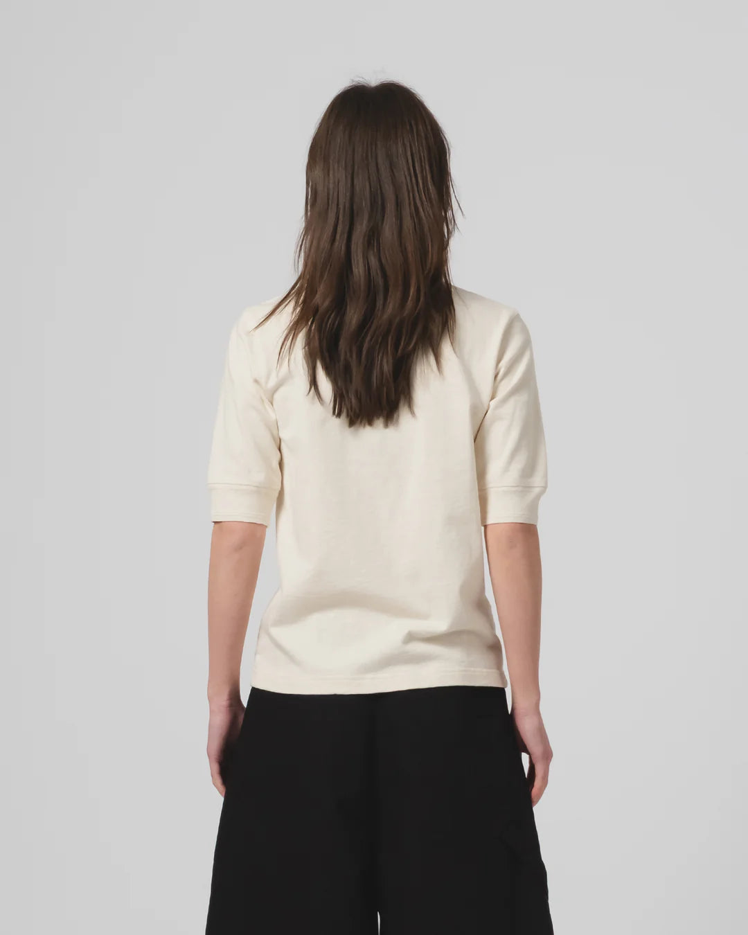 Woman wearing Girls Of Dust Off - White Short Sleeved T-Shirt against a white background 