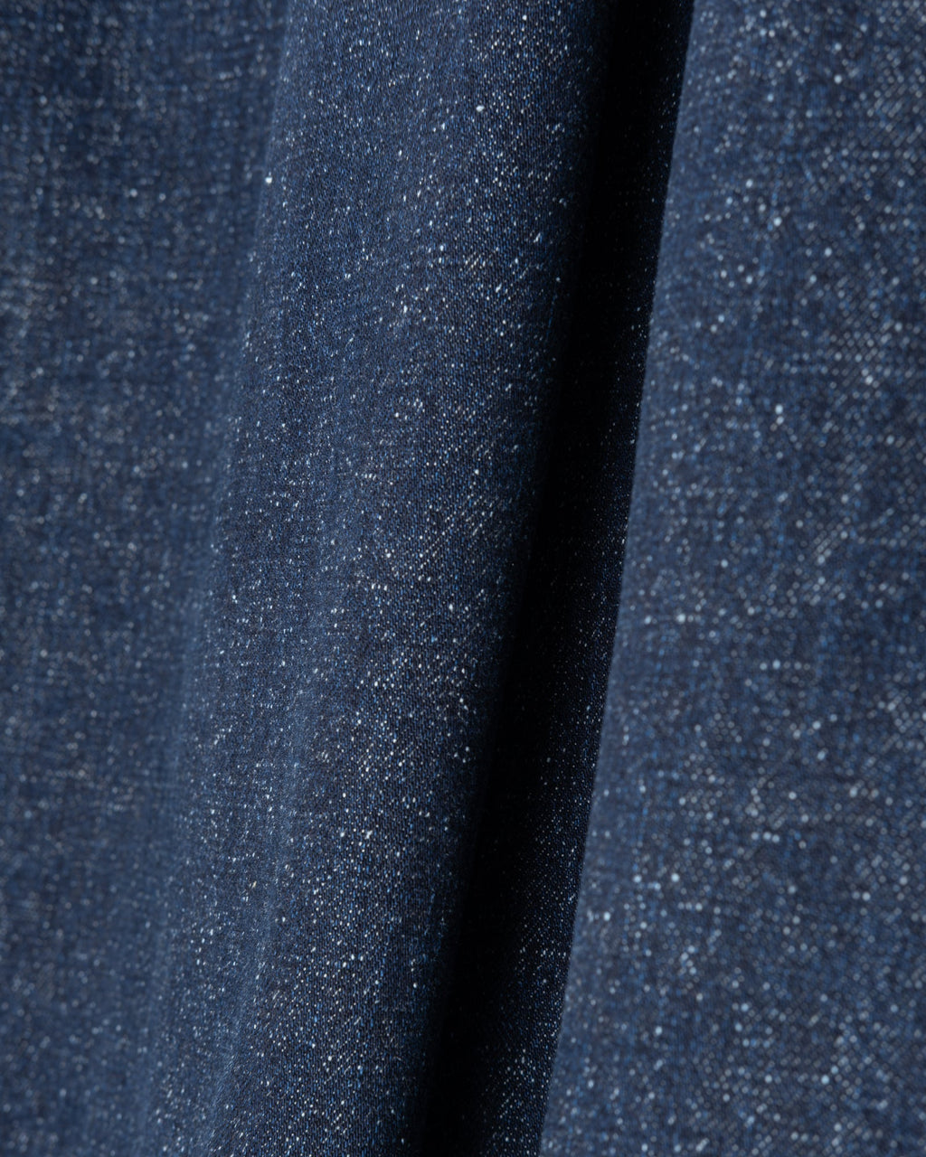 Close-up of blue denim fabric of the Girls of Dust Meadow Skirt Neppy Denim Indigo 