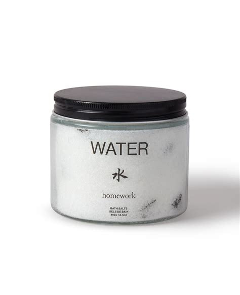 Jar labeled 'Water' with black lid on a white background