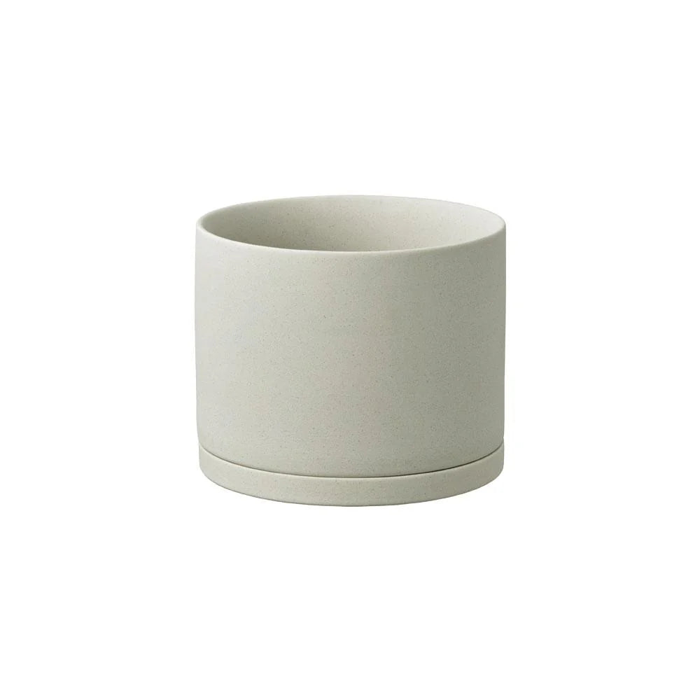 Grey plant pot one a white background 