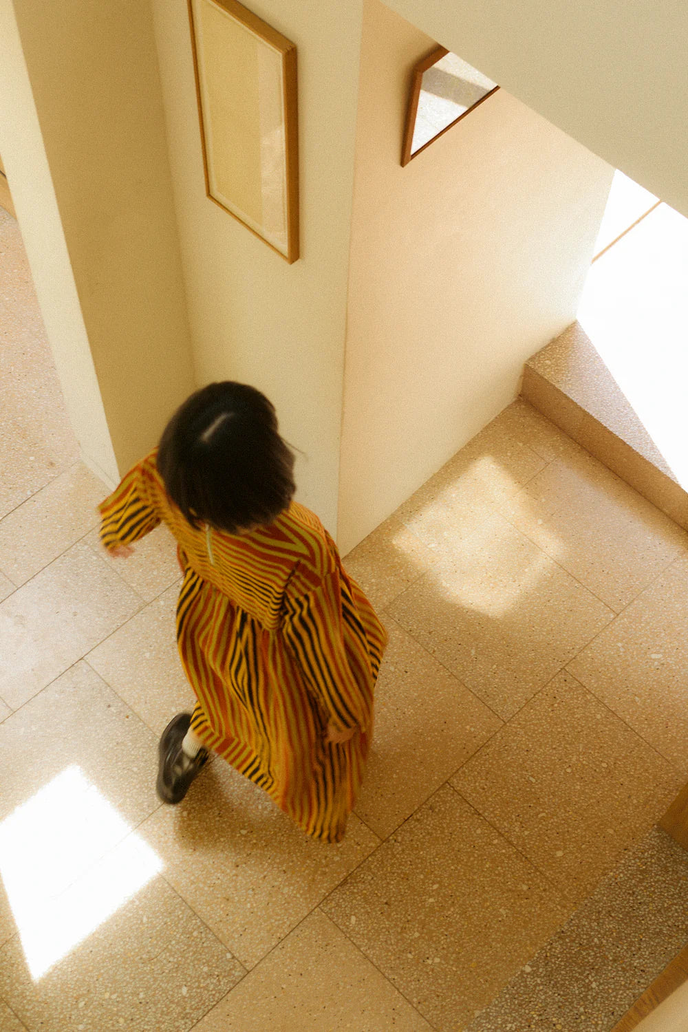 A person wearing the LF Markey stripe dress view from above 