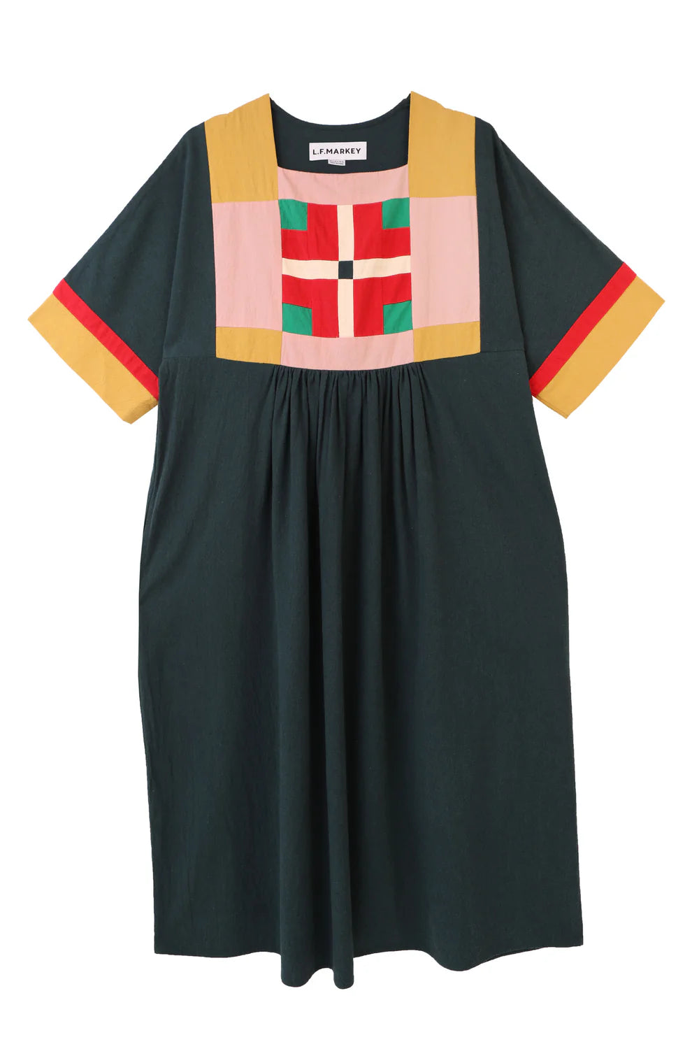 Dark green crepe dress with colourful geometric pattern on a white background