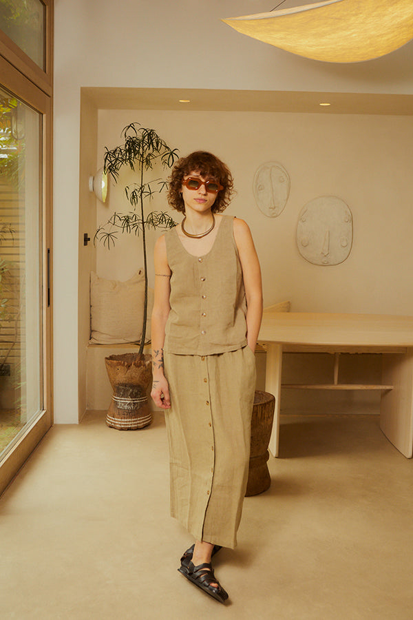 Woman wearing a LF Markey Basic Button Front Skirt in Stone with the matching tank top in a minimal House