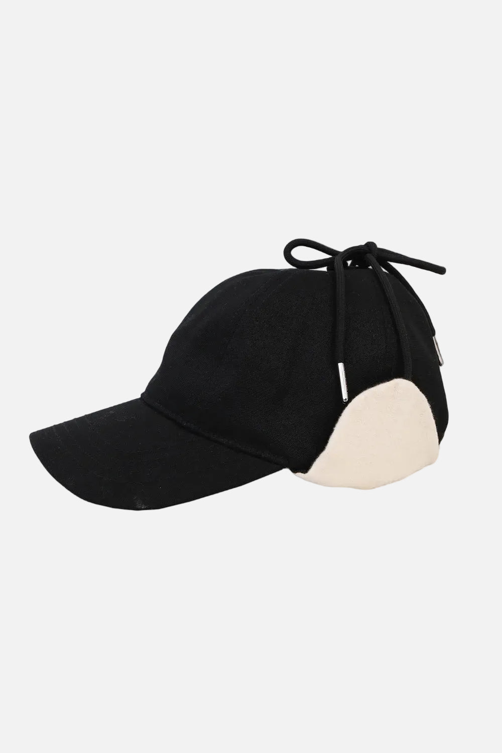 Black cap with a white brim on a light grey background