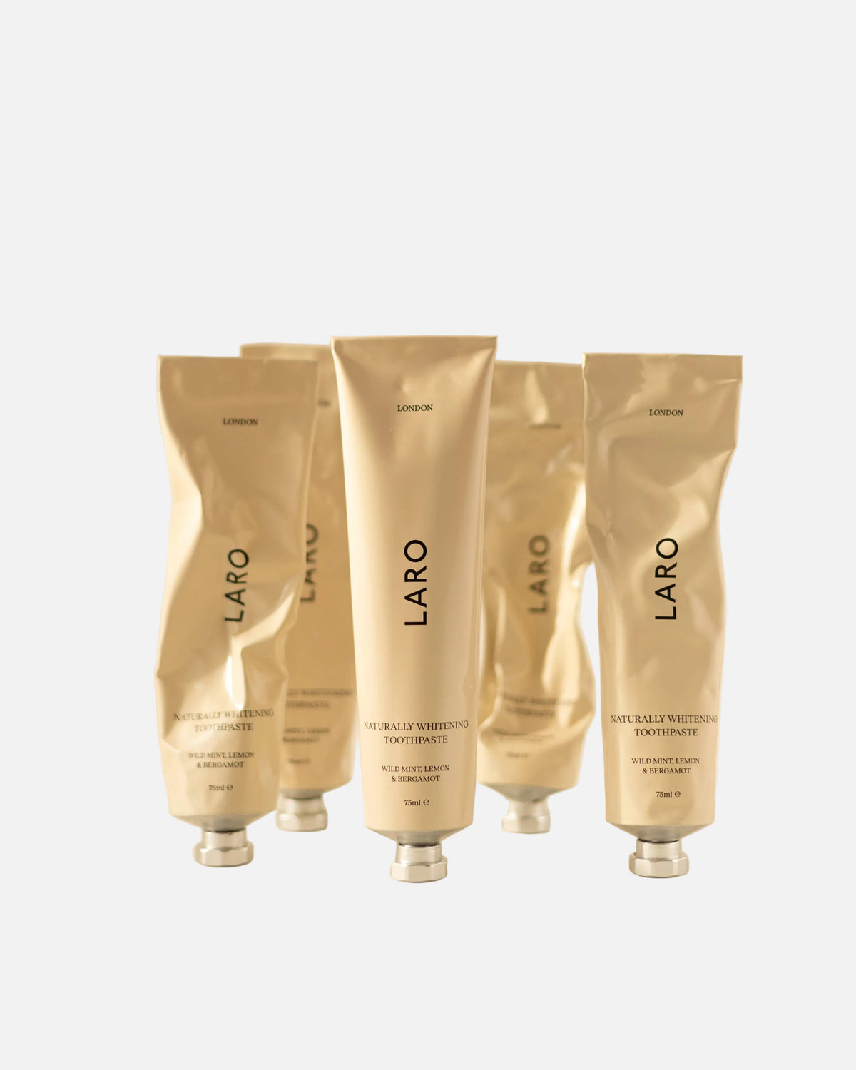 Set of Laro toothpaste  products on a light grey background