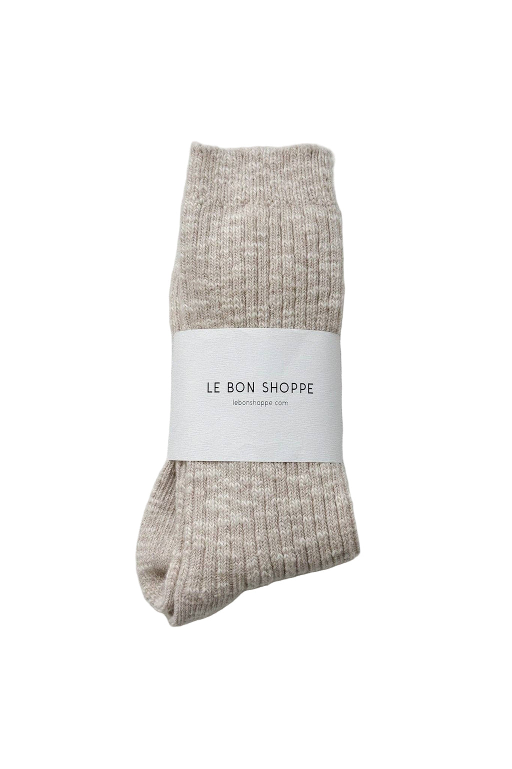 Pair of beige Le Bon Shoppe socks with a white label on a white  background