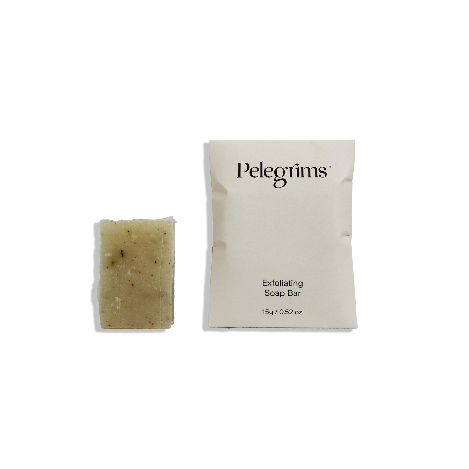 Exfoliating soap bar and packaging with 'Pelegrims' branding on a white background