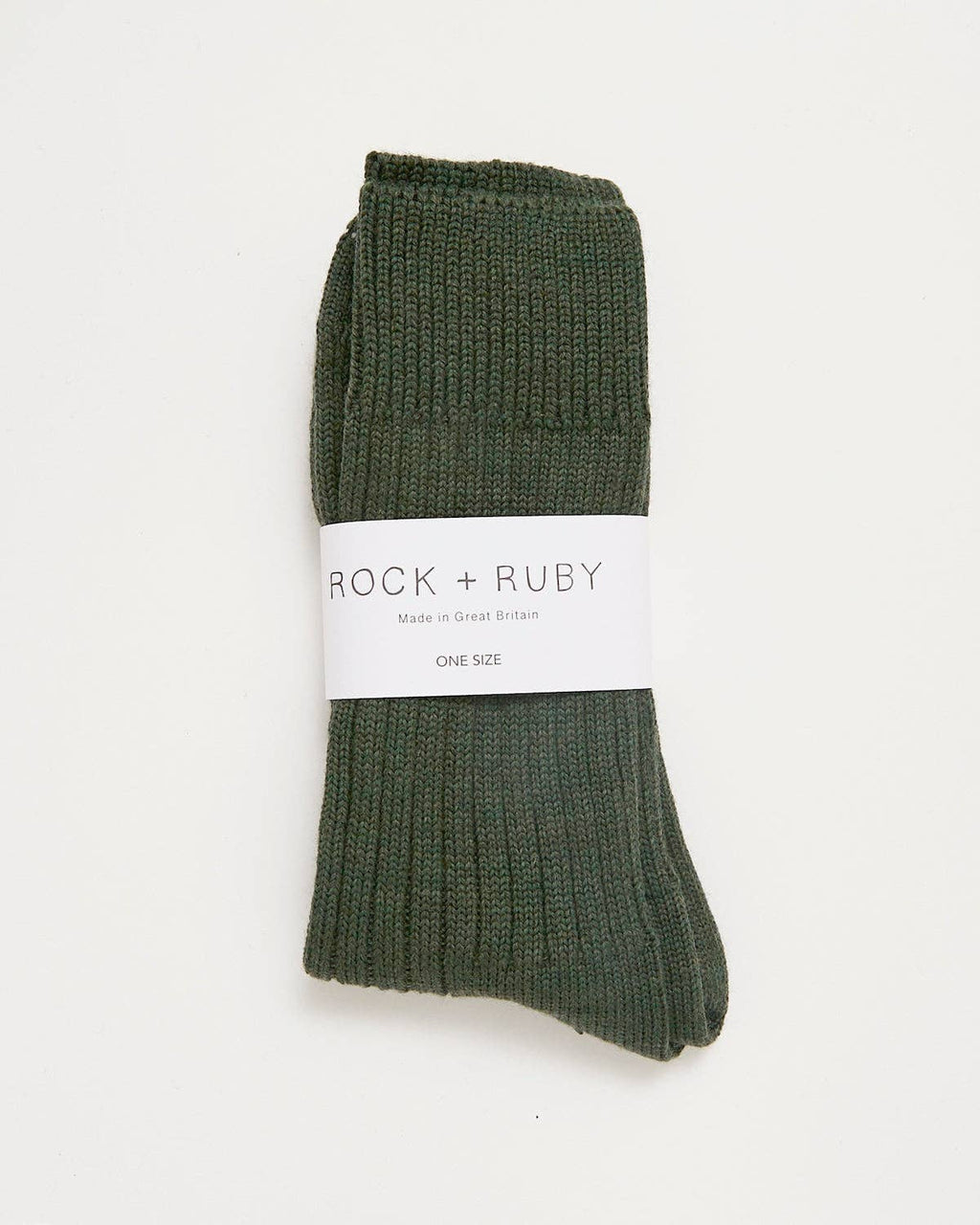 Pair of green socks with a 'Rock + Ruby' label on a white background