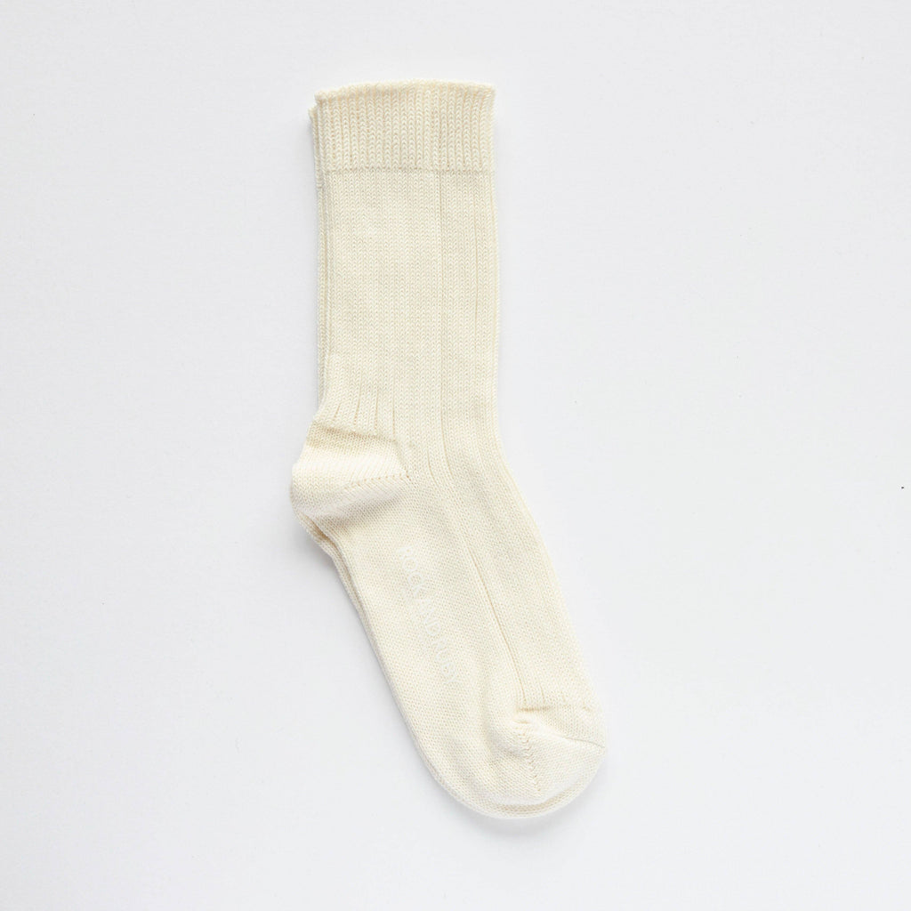 Cream sock on a light gray background