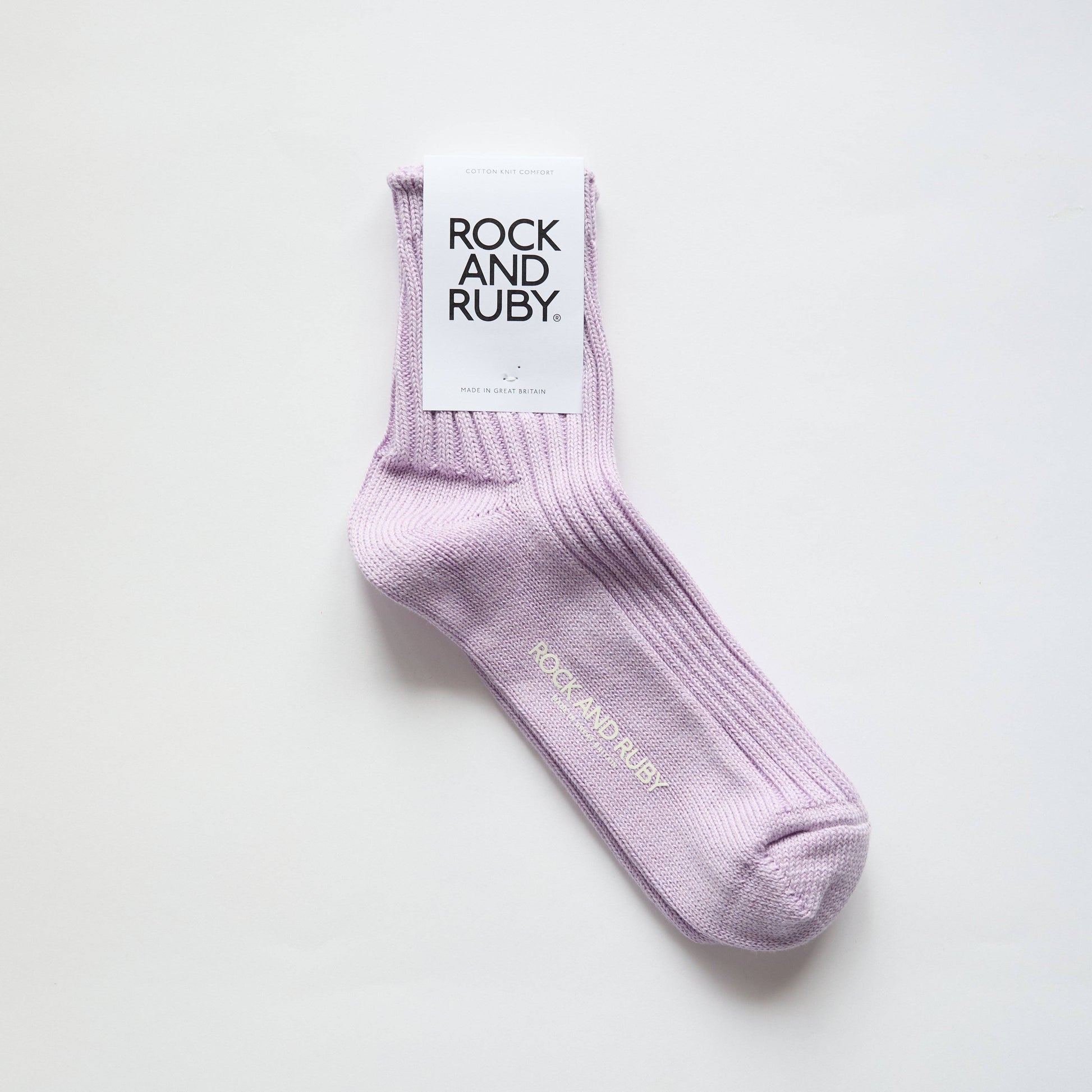 Purple sock with 'Rock and Ruby' branding on a white background