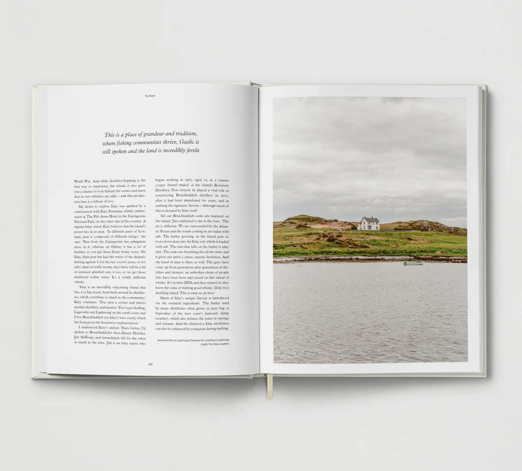 Open book with text on one page and a photograph of a house on an island on the other, against a white background.
