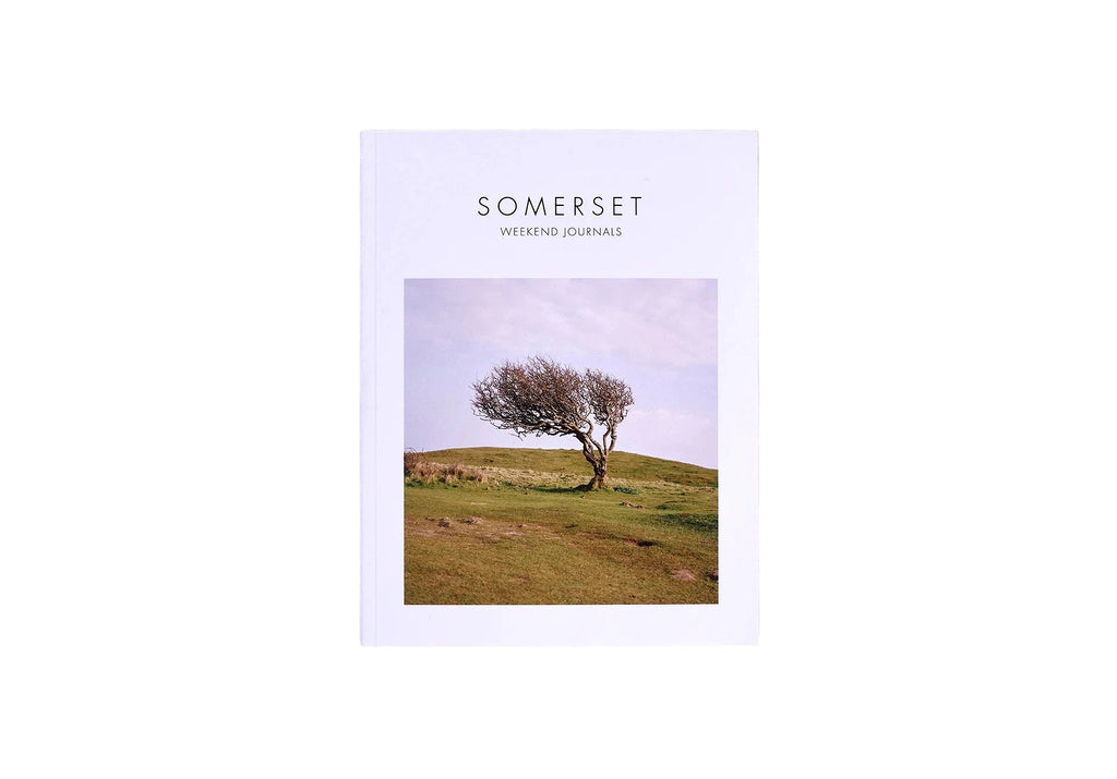 Weekend Journals Book titled 'Somerset' with a cover photo of a tree on a grassy hill, on a white background.