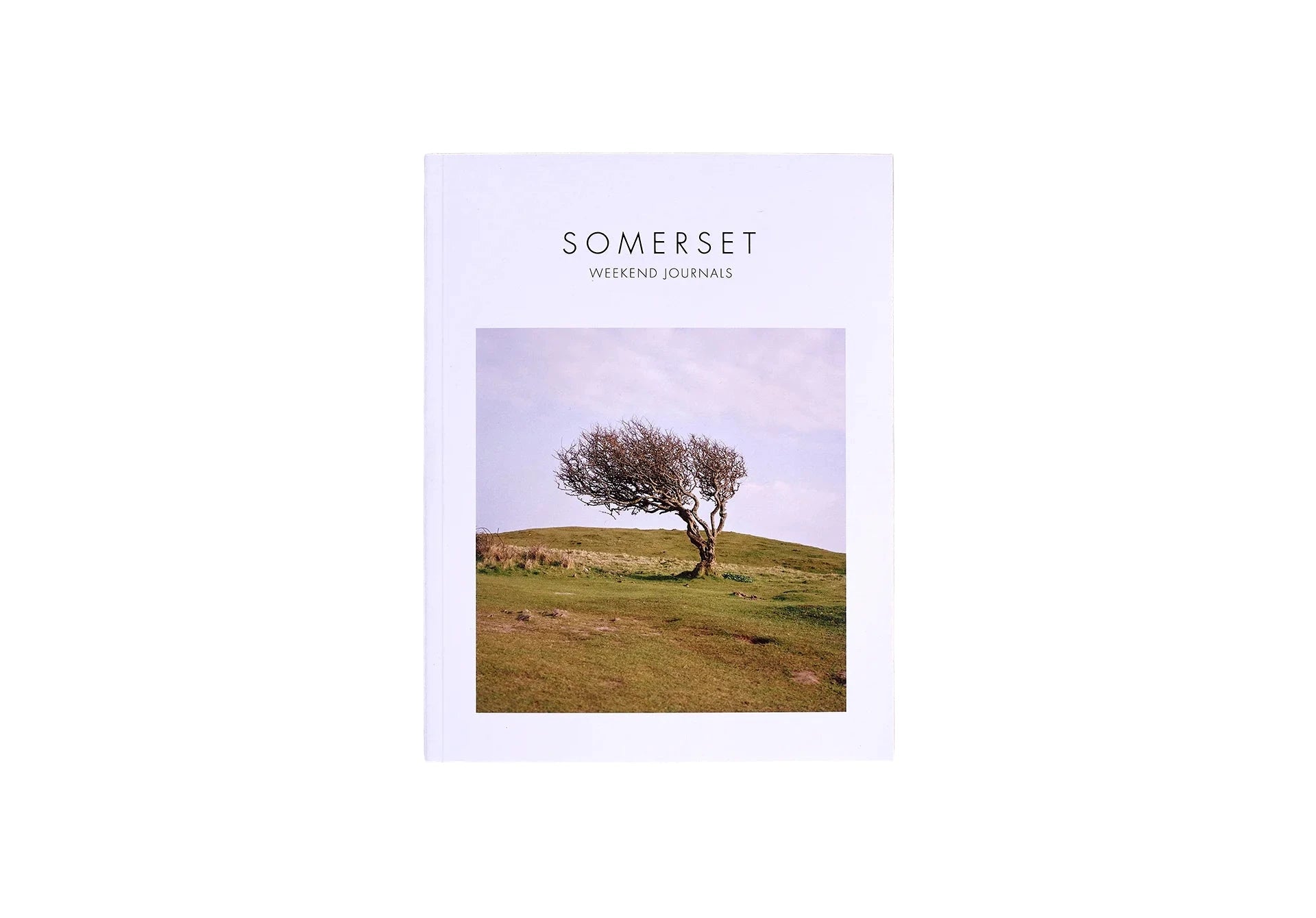 Weekend Journals Book titled 'Somerset' with a cover photo of a tree on a grassy hill, on a white background.