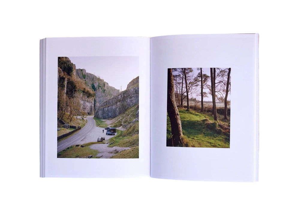 Open book showing two scenic photographs on a white background