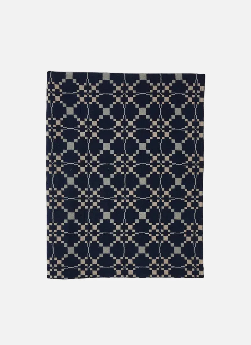 Toast Lattice Cloth rectangular blanket, featuring a dark navy blue and beige geometric pattern, displayed flat against a light gray background.