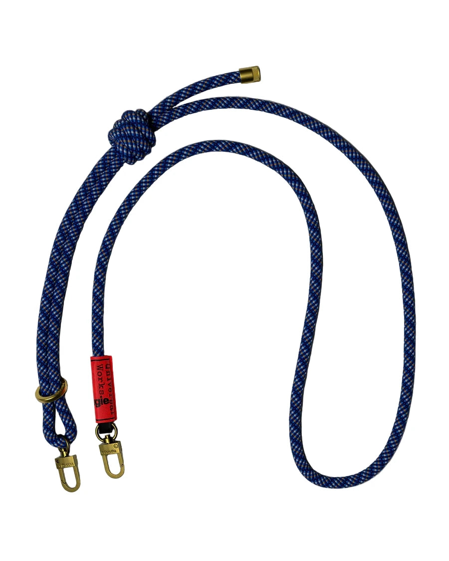Blue rope with gold hardware and a red label on a white background