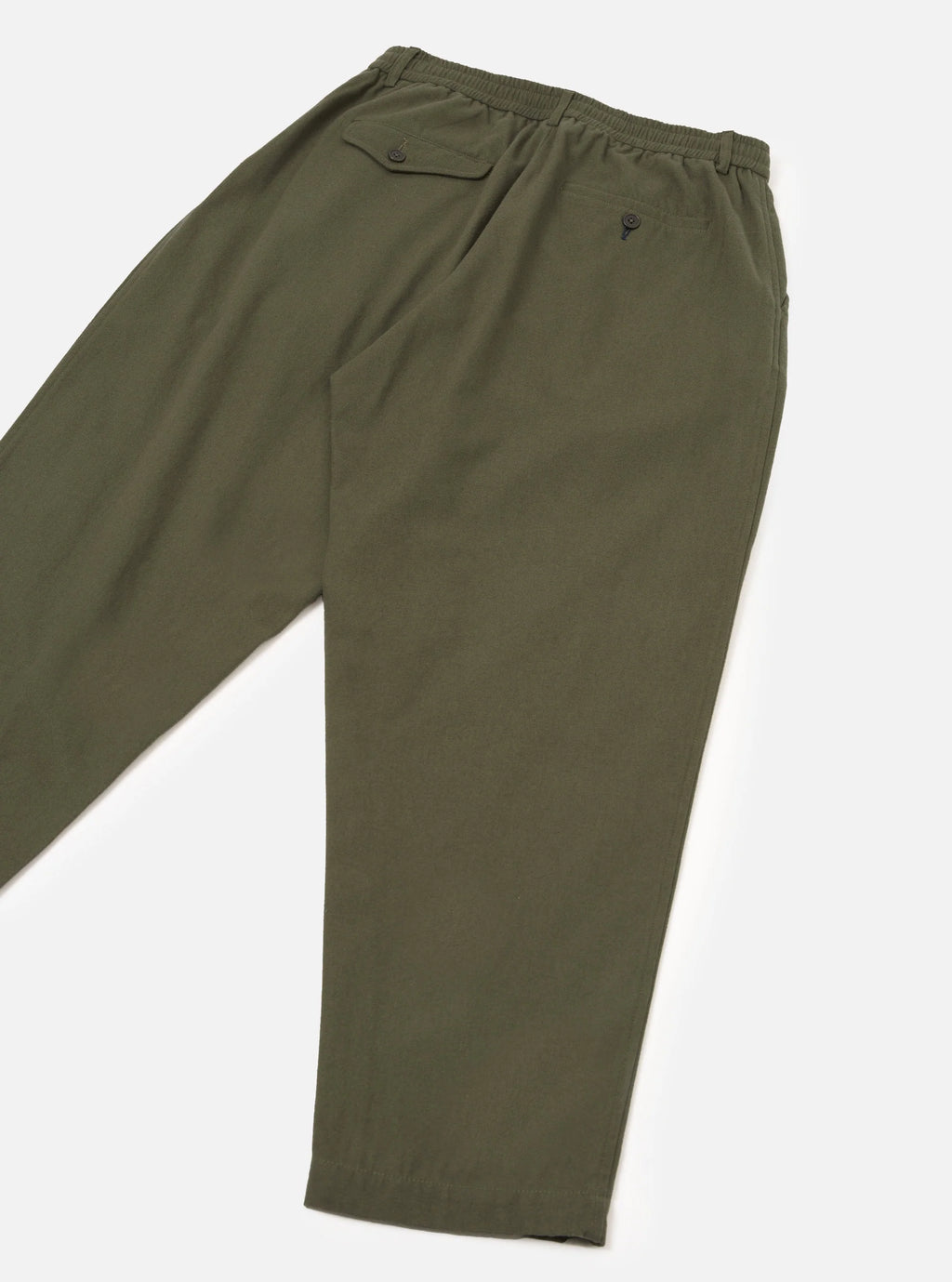 Olive green trousers shown from a side angle, featuring an elastic waistband, a buttoned welt pocket on the hip, and a small embroidered logo on the upper thigh.