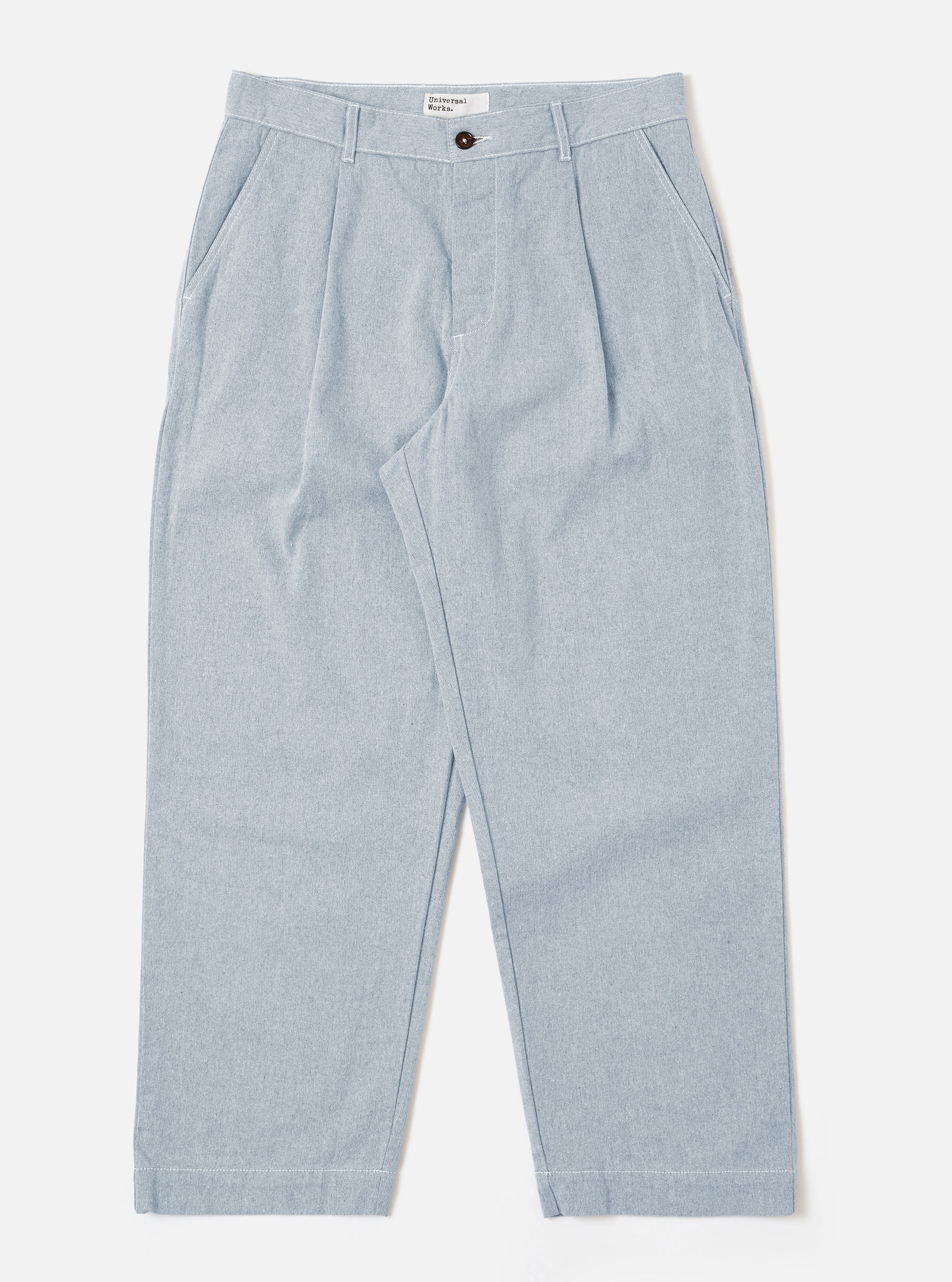 Universal Works Duke Pant in Light Denim against a white background 