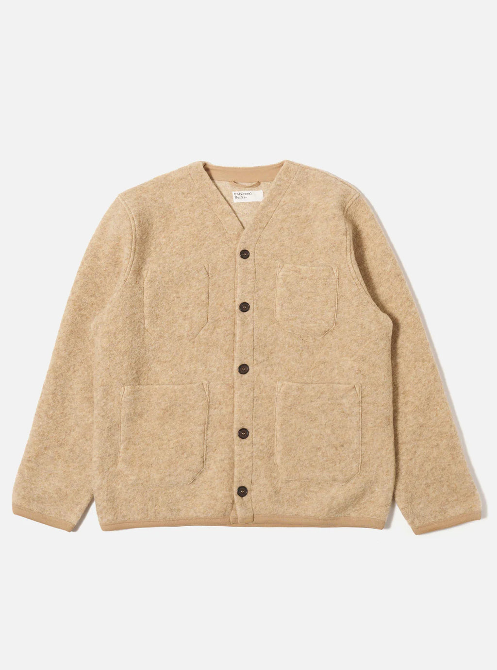 Universal Works beige cardigan with black buttons on a light grey background