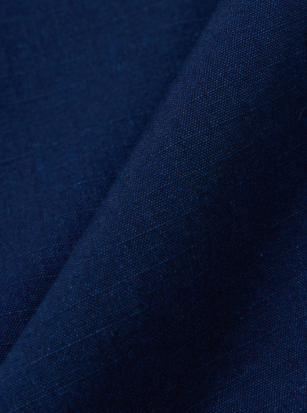 Close up of Navy Kinston fabric of the Universal Works Indigo Track Pant. 