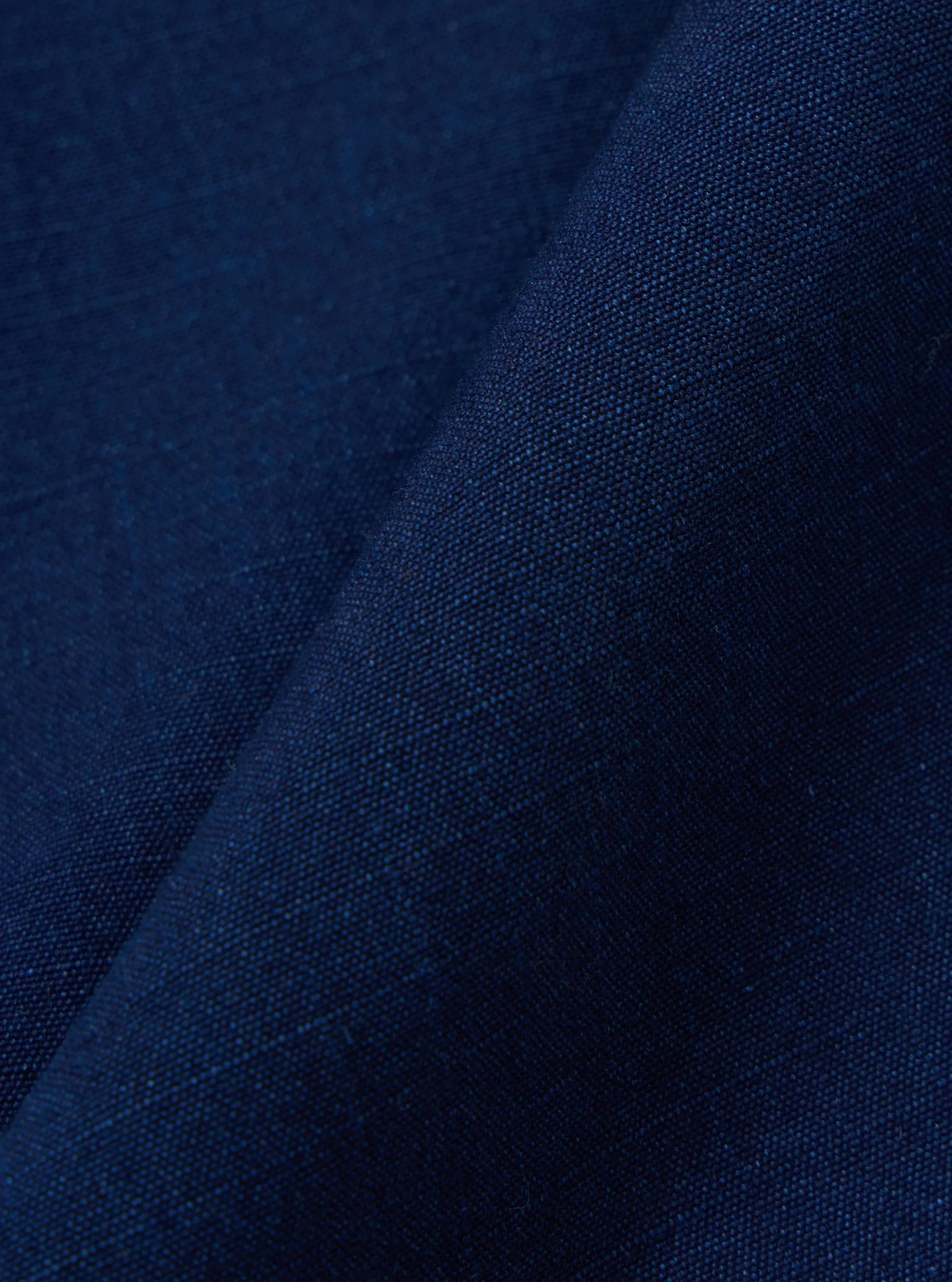Close up of Navy Kinston fabric of the Universal Works Indigo Track Pant. 