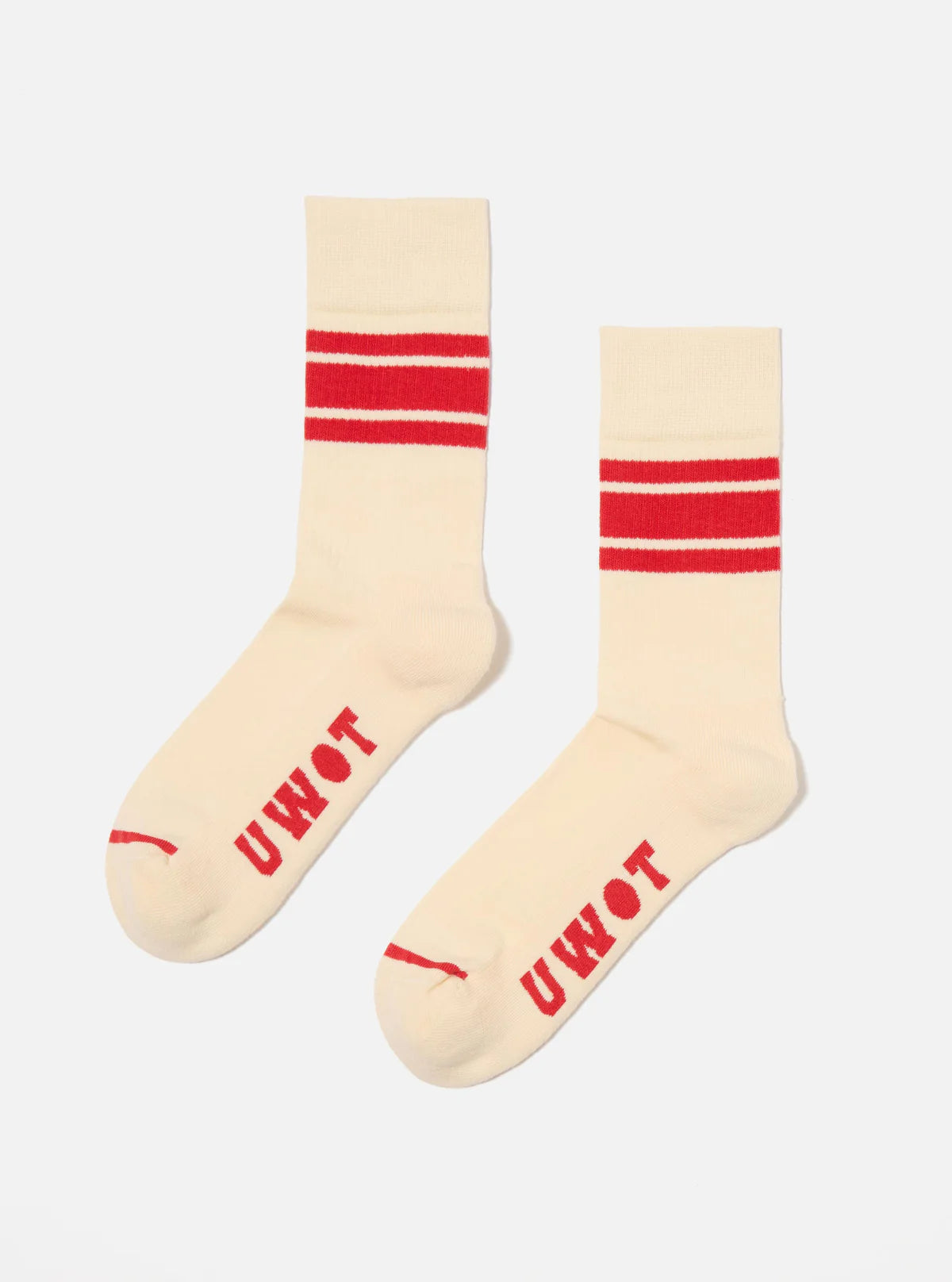 Topologie x Universal Works Ecru socks with a red stripe on a white background