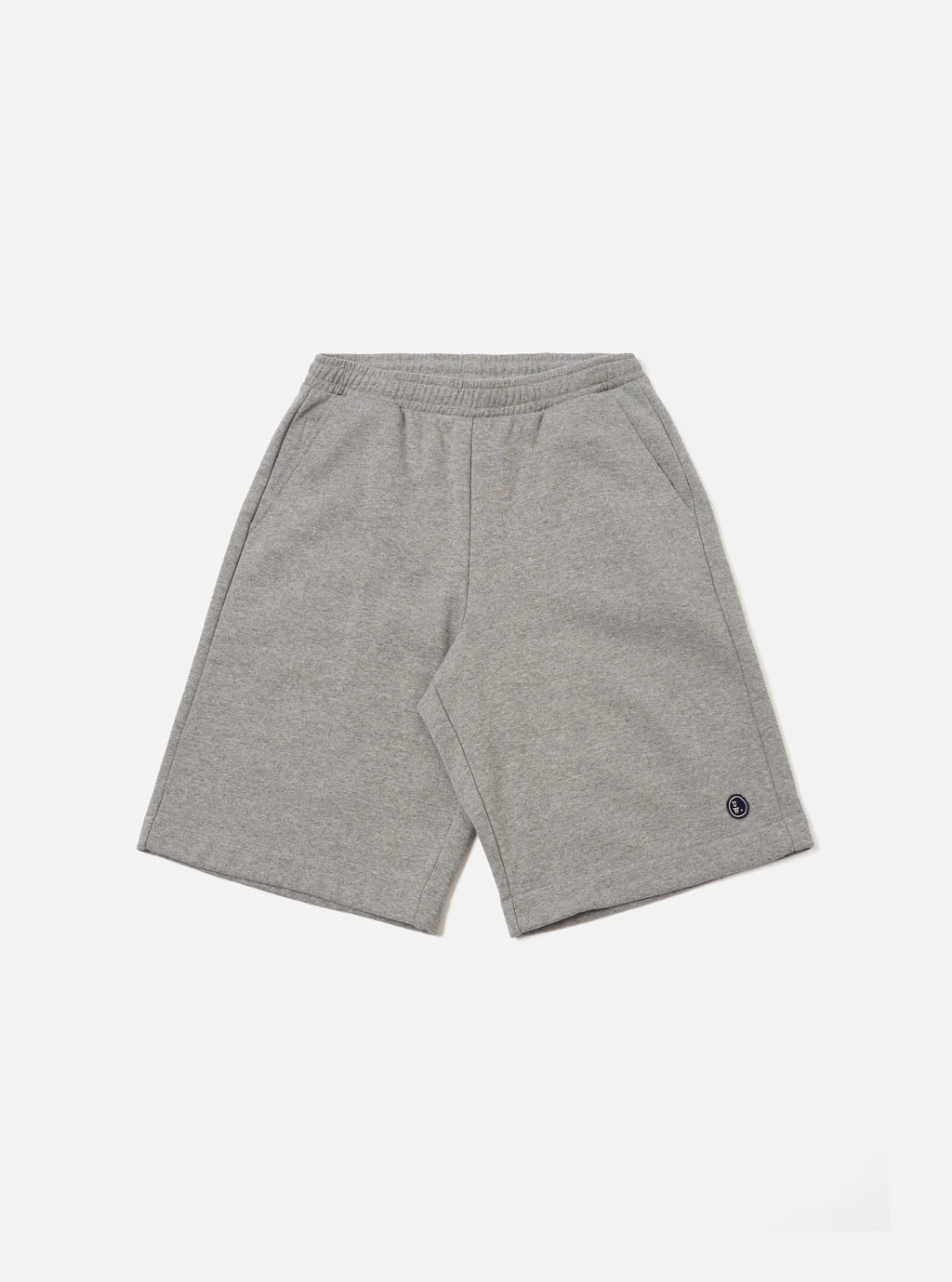 Universal Works Grey jogger shorts against a white background.