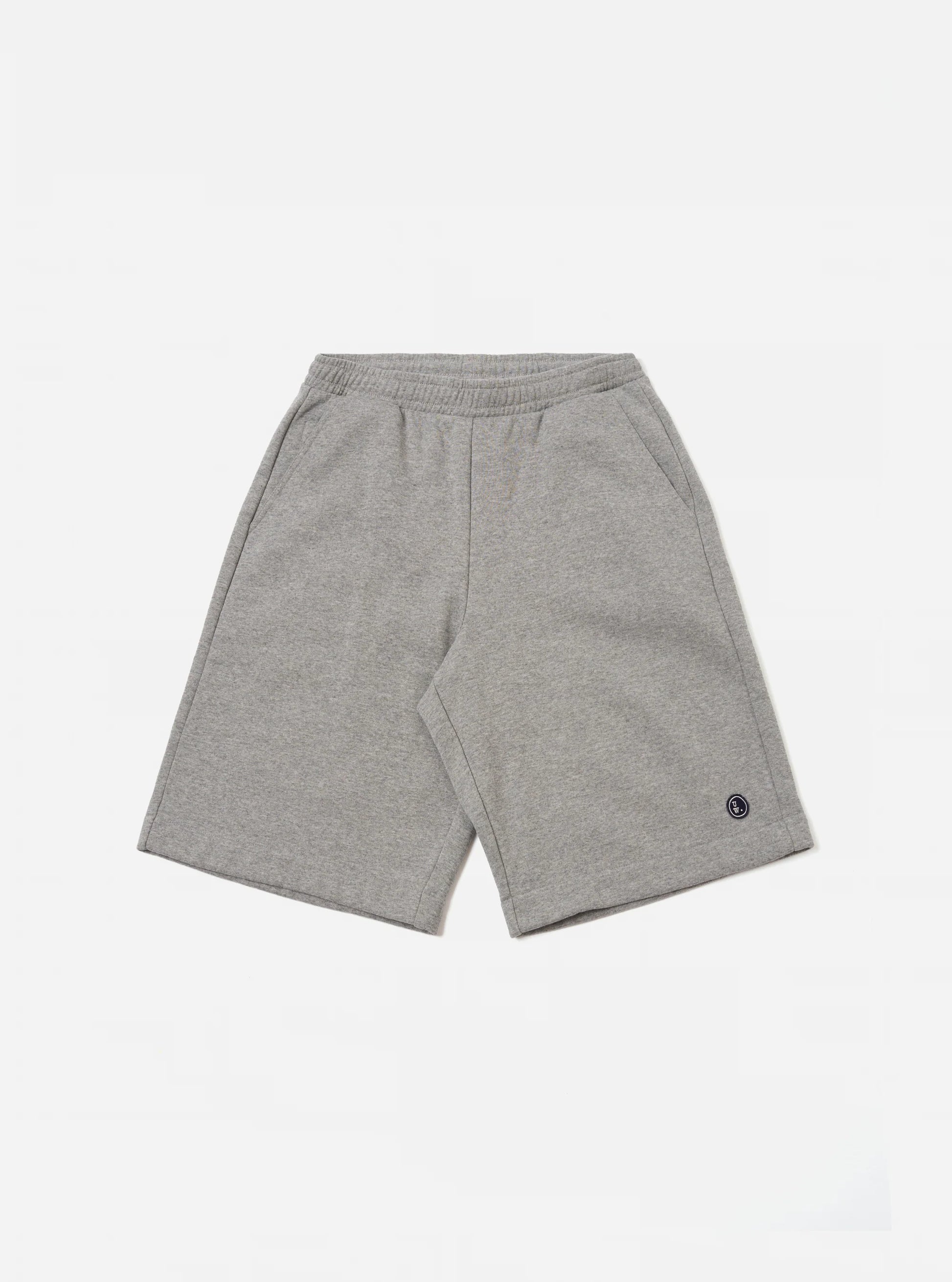 Universal Works Grey jogger shorts against a white background.