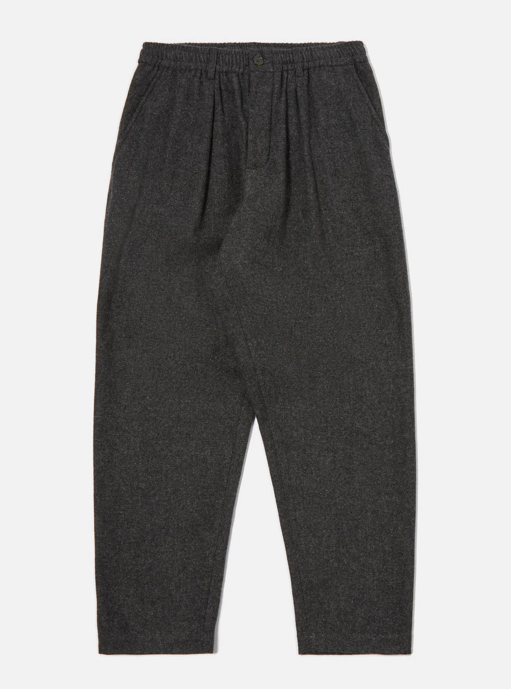 Universal Works Dark grey up cycled wool trousers  on a light gray background