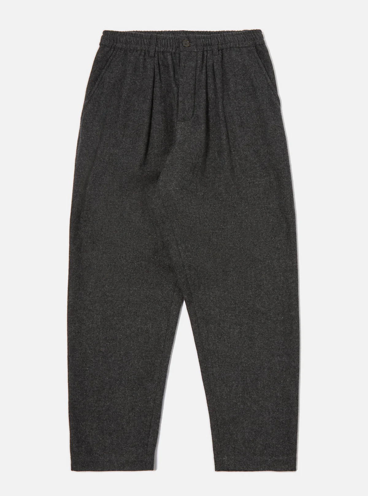 Universal Works Dark grey up cycled wool trousers  on a light gray background