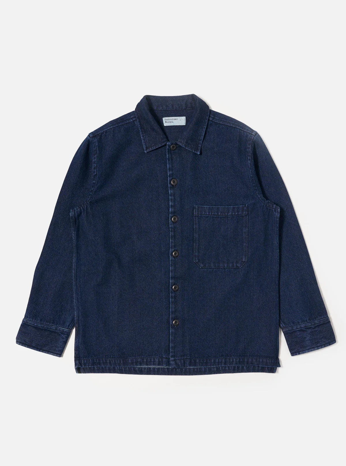 Universal Works navy denim shirt on a light gray background