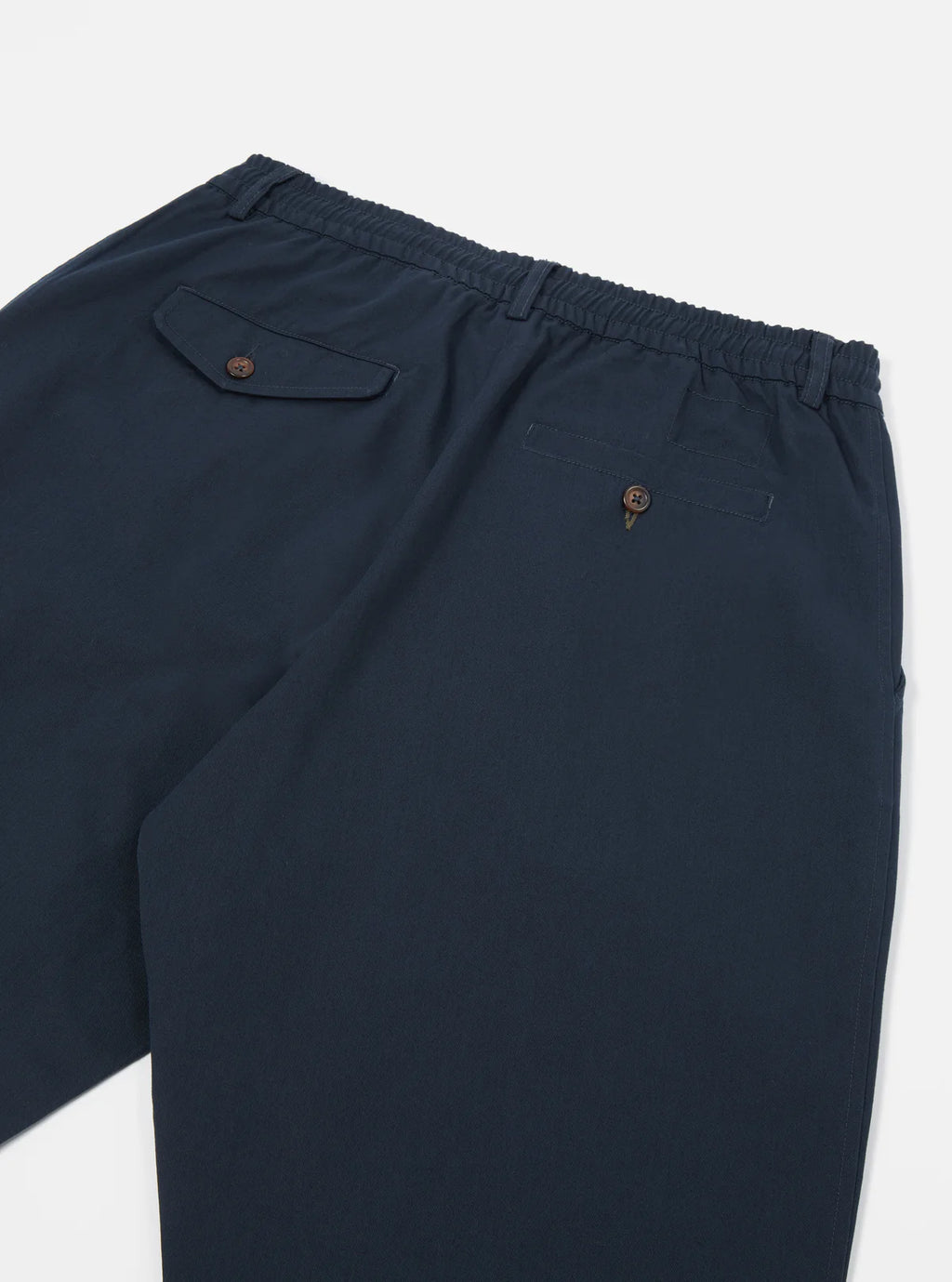 Universal Works navy blue trousers with a pocket on a white background