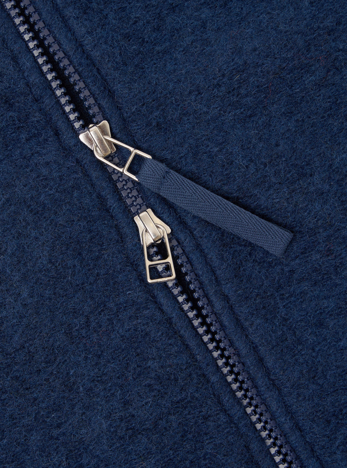 Close up of the double zip detail of the Universal Works Zip Bomber 