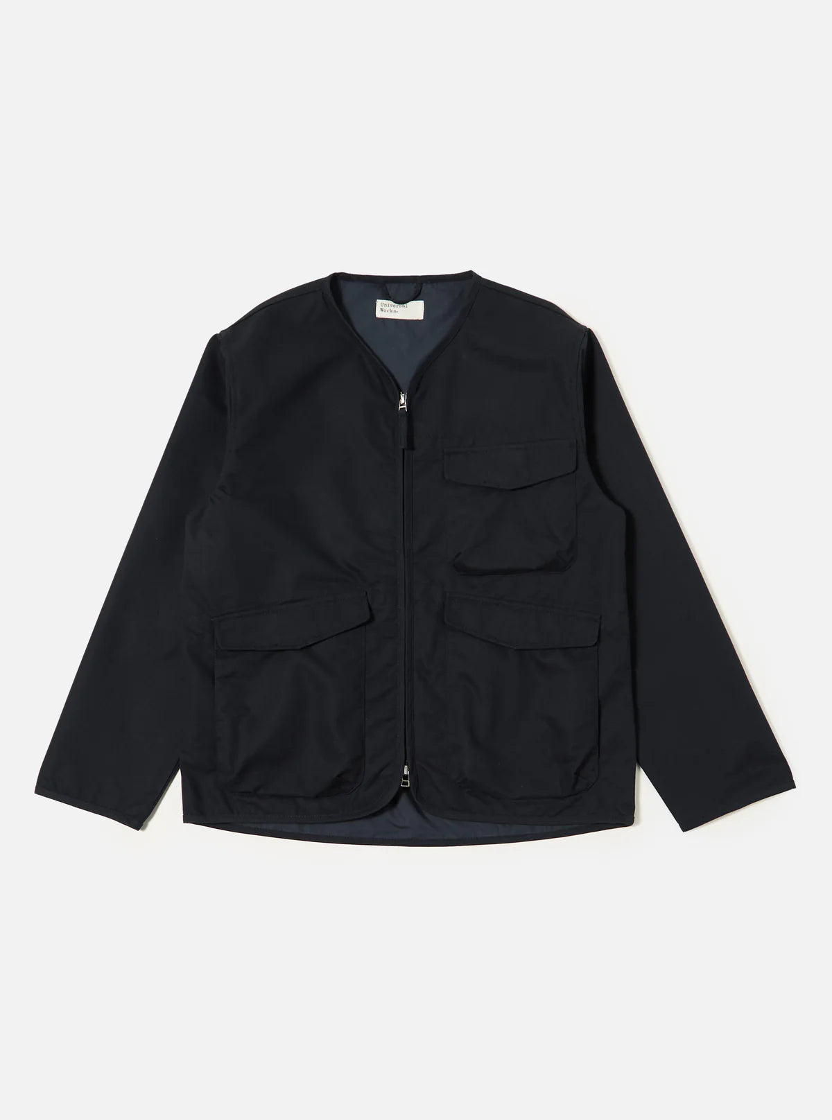 Universal Works navy  jacket with multiple pockets on a white background