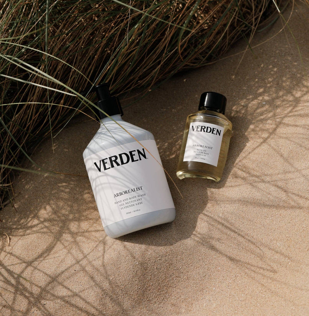 Two Verden bottles on a textured surface with natural elements.