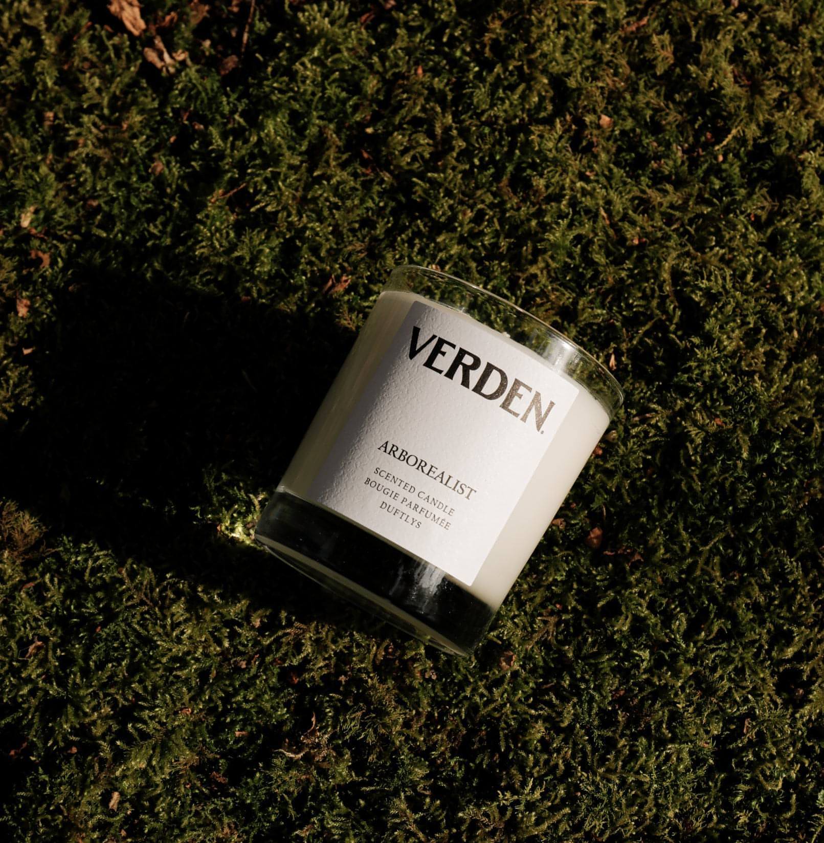Verden candle on a mossy surface