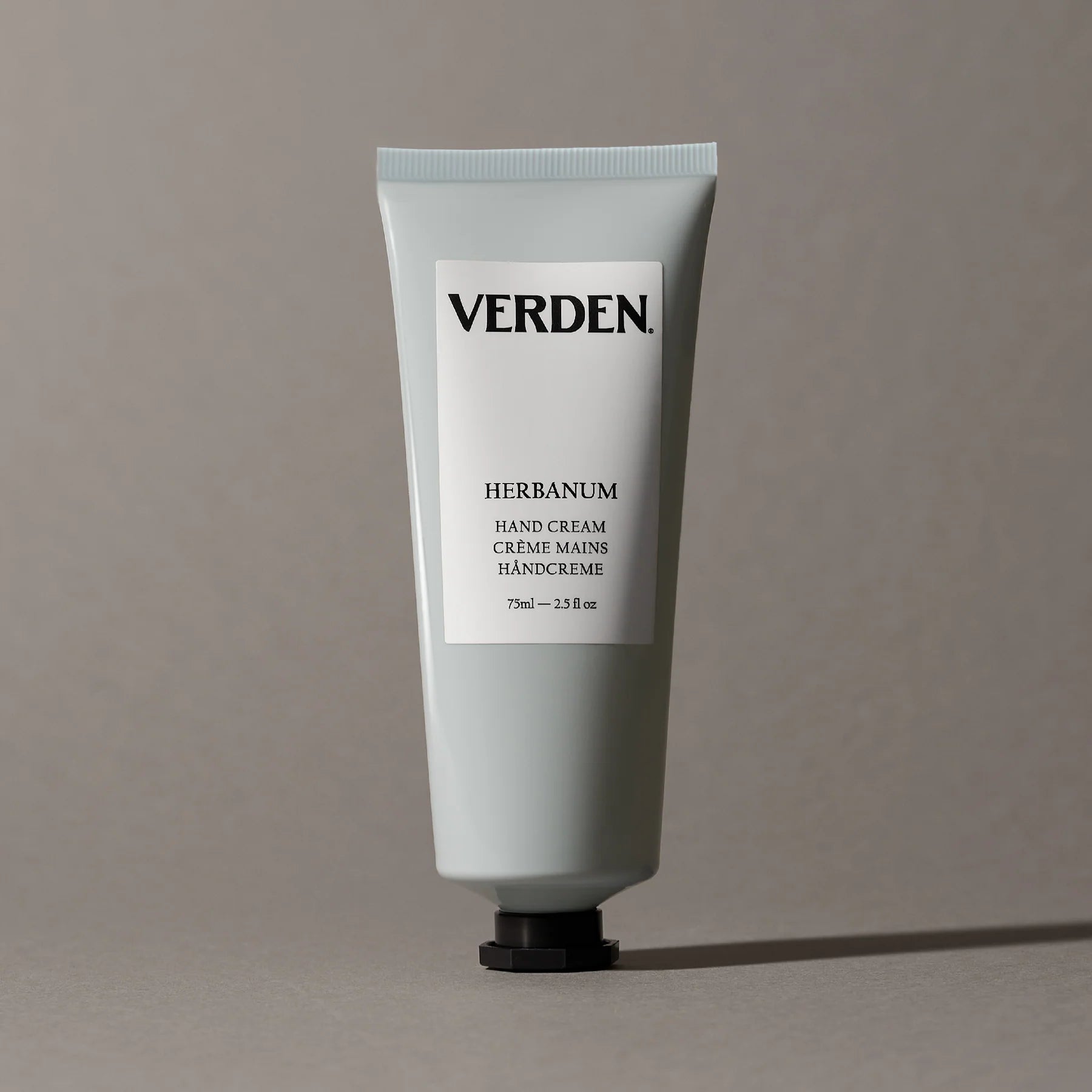Verden Herbanum hand cream tube on a gray background