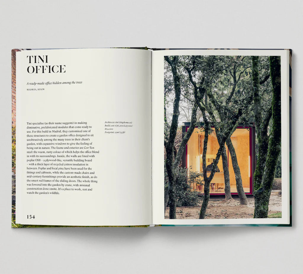 Open book showing text and a photograph of a yellow building surrounded by trees.